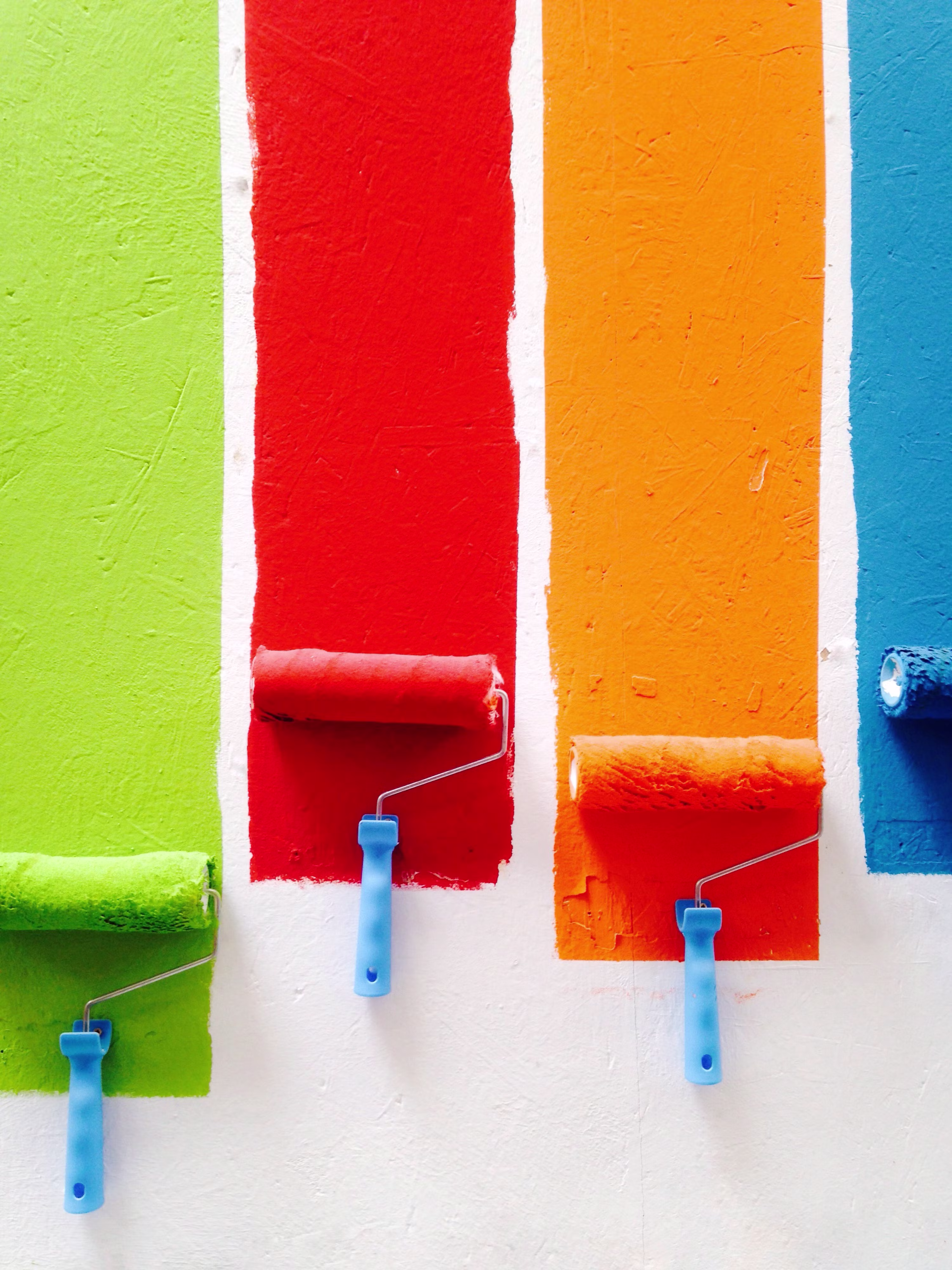 Professional paint roller applying fresh paint to interior wall by Bilal Painting